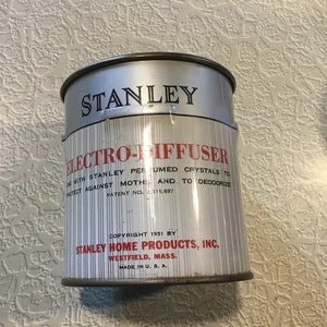 May include: A silver can with a red and black label that reads "Stanley Electro-Diffuser" with the text "Use with Stanley Perfumed Crystals to Protect Against Moths and to Deodorize. Patent No. 2,315,697. Copyright 1951 by Stanley Home Products, Inc. Westfield, Mass. Made in U.S.A."