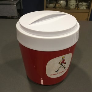 May include: Red and white insulated cooler with a white lid and a Johnnie Walker Red label featuring a man in a red jacket walking with a cane.