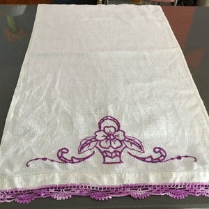 Vintage hand embroidered linen runner/vanity table cover natural cotton & purple needlework of a flower in a brides basket, scalloped trim
