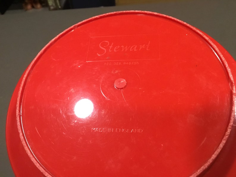 May include: Red plastic bowl with the text "Stewart" and "Reg. Des. 846703" on the bottom. The bowl also says "Made in England".