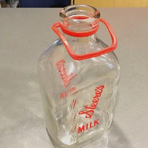 2 quart glass milk jug bottle STEERES MILK half gallon milk jug from Meadville Pa, or Georgiaville RI with red Pyro print Duraglas M 265 X