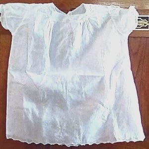 French white cotton vintage baby dress w very intricate needlework, very expensive for it’s day for baby or doll size unknown
