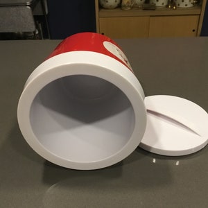 May include: A red and white insulated cooler with a white lid. The cooler is open and the inside is white.