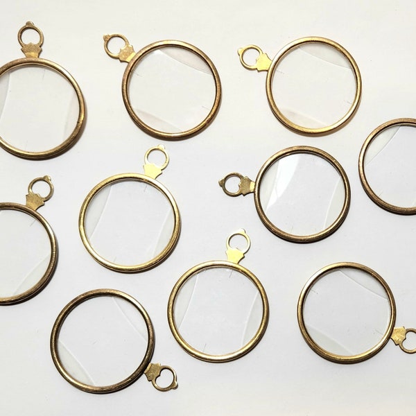 Lot of 10 antique/vintage trial lenses optical test lens pendants. Gold tone