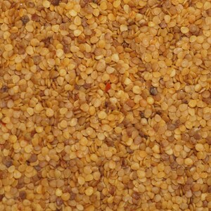 May include: A close-up view of a pile of small, light brown peppercorns.