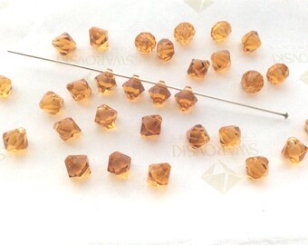 30 pieces Swarovski #6301 6mm Crystal Topaz Top Drilled Faceted Bicone Pendants Beads