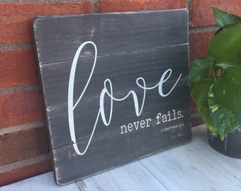 Love Never Fails. 1 Corinthians 13:8 / Scripture Sign / Weathered Wood / Bible Verse Wall Art •
