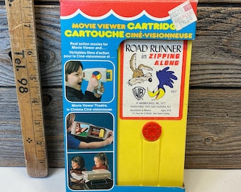 Cartucho de reproductor de películas Fisher Price antiguo de 1977 Road Runner en movimiento