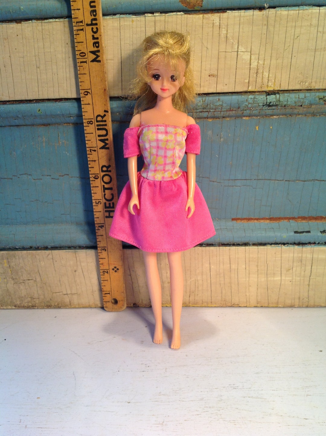 Lot - TAKARA BARBIE FROM THE HIROMICHI NAKANO COLLECTION AMERICAN DOLL. SHE WEARS A PLAID COAT