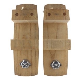 May include: A pair of wooden geta sandals with a floral design on the front. The sandals are made of natural wood and have a simple, traditional design.