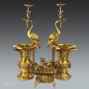 vintage buddhist altar tool set with candle holders and vases - intricate detail