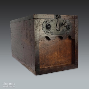 Bring grounded presence, quiet strength, and centuries of Japanese history into your interior with this exceptionally large Edo-period zenibako - a rare merchant money box carved from thick hardwood and reinforced with hand-forged iron.