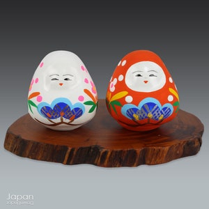 pair of japanese daruma shape dolls, red and white daruma shape dolls, japanese lucky charm, japanese folk craft, kaga hachiman okiagari