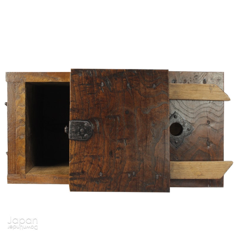 A wonderful old antique Japanese box used for safely storing money. In the Edo period the Japanese government distributed a small, copper coin, known as the zeni which was used for around 260 years.