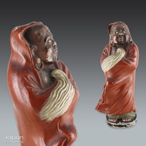 japanese antique standing ceramic daruma in red robe