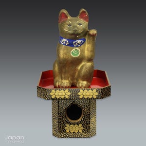 japanese antique gold maneki neko - lucky cat on black lacquer stand