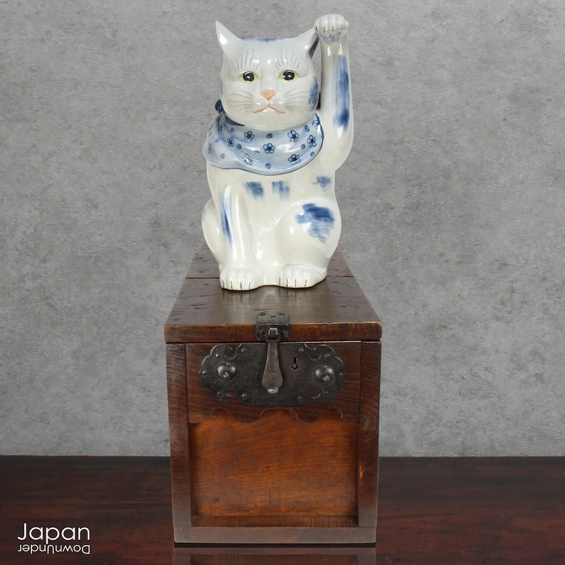 A wonderful old antique Japanese box used for safely storing money. In the Edo period the Japanese government distributed a small, copper coin, known as the zeni which was used for around 260 years.