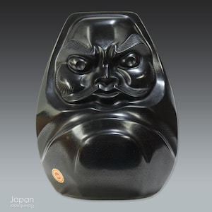 large vintage daruma figure crafted from black nachiguro  slate - Japanese go game stone material