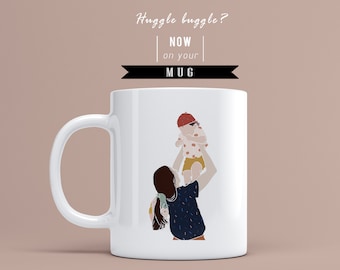 May include: White ceramic mug with a colorful illustration of a person holding a child in the air. The text "Huggle buggle? NOW on your MUG" is printed on the top of the mug.