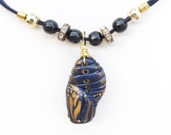 Monarch Chrysalis Necklace in Navy Blue and Metallic Gold Colours, Emerging Butterfly Stylized Polymer Clay Insect Jewelry