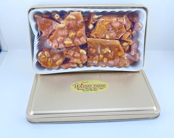 Peanut or Pecan Brittle Gift Tin. Available in two sizes. This crunchy delight is loaded with peanuts or Texas Pecans.