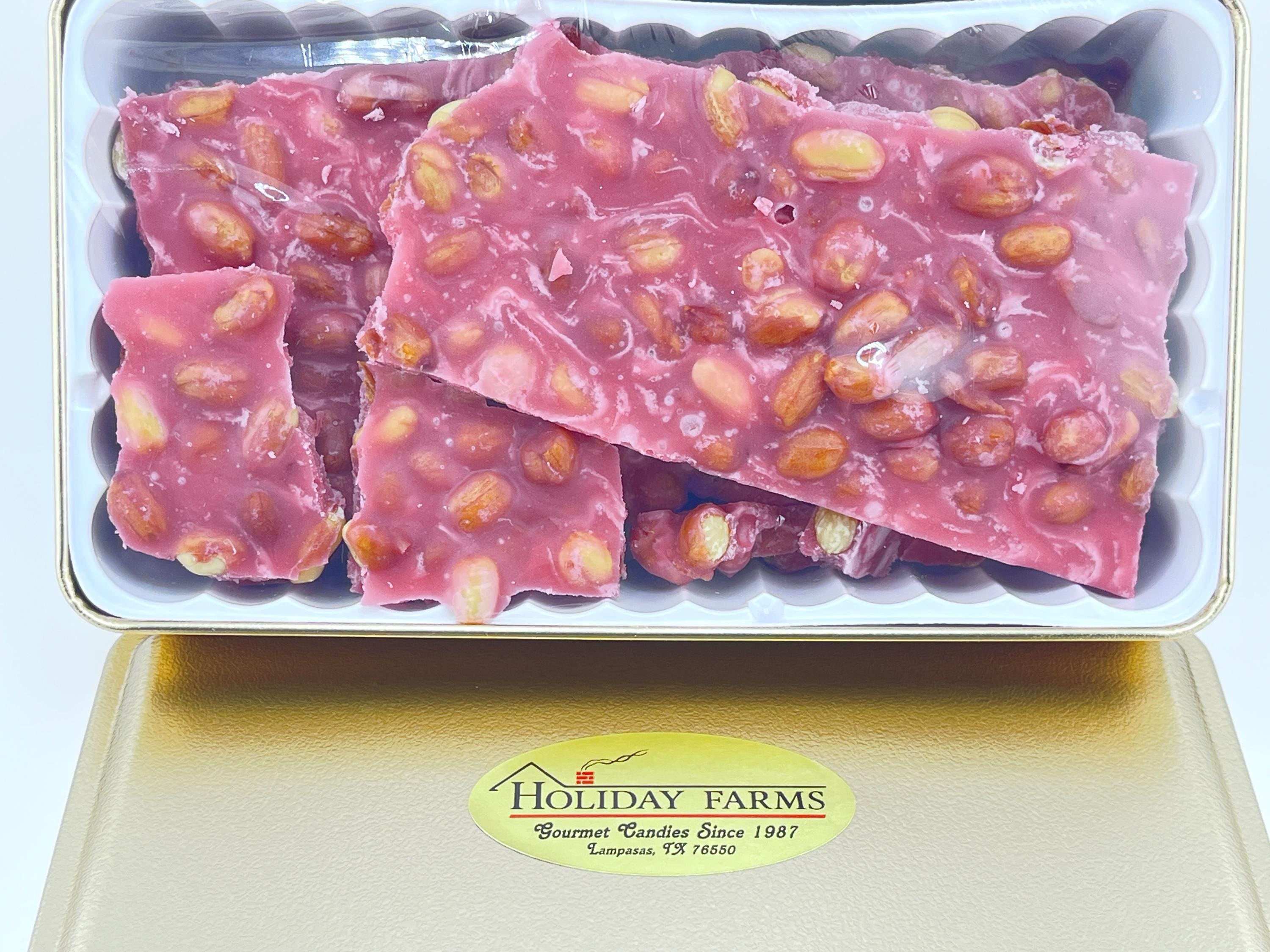 This crunchy delight is loaded with peanuts or Texas Pecans. This crunchy and delicious treat comes in a season gift tin.