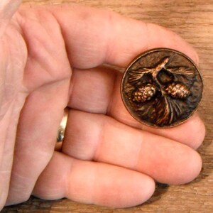 Real cast metal-PINECONE cabinet knob - Hand poured in Montana. Rustic hardware, with a several patina choices.