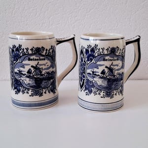 Pair of vintage Heineken Delft Blue beer mugs, Dutch beer steins