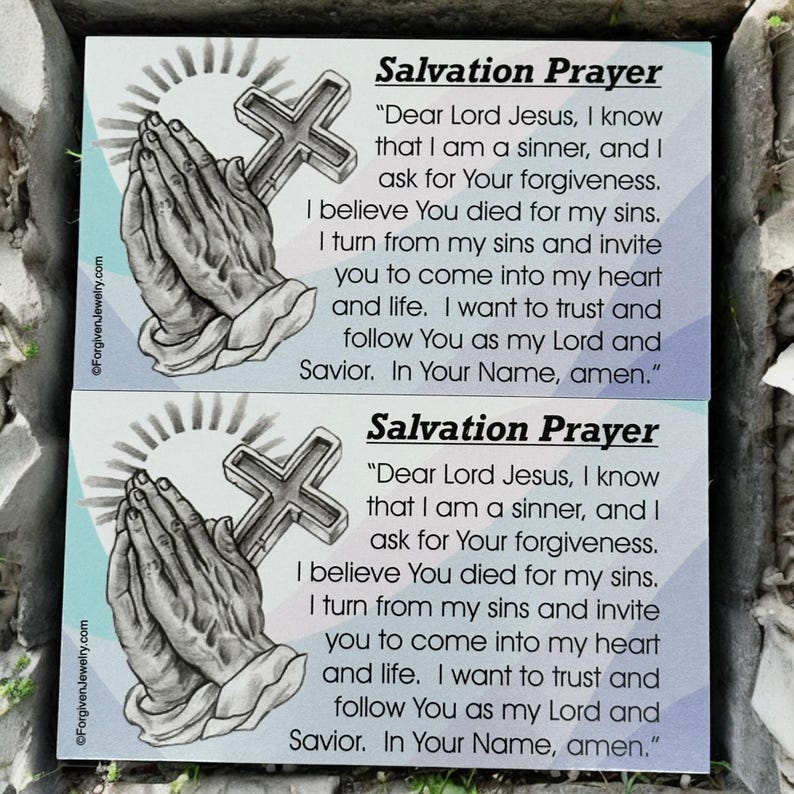 May include: Two blue and white cards with a black and white illustration of praying hands and a cross. The cards have the text "Salvation Prayer" and a prayer written in black text.