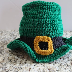 May include: A green crocheted leprechaun hat with a black and gold buckle.