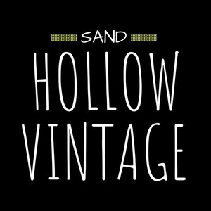 May include: Black and white graphic text design with the words "SAND HOLLOW VINTAGE" on a black background.