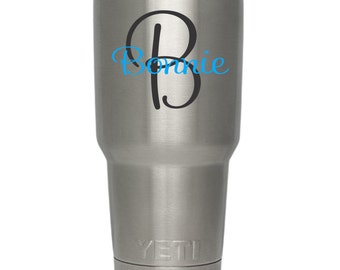 May include: Stainless steel YETI tumbler with a black and blue monogrammed sticker that says "Bonnie".
