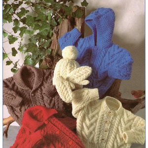 May include: A collection of hand-knitted garments including a blue hooded sweater with cable patterns, a brown button-up cardigan, a red button-up cardigan, a cream-colored button-up cardigan, and a cream-colored pom-pom hat with matching mittens.