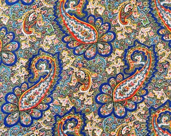 May include: A paisley patterned fabric with a blue background and intricate designs in shades of red, orange, yellow, green, and white.
