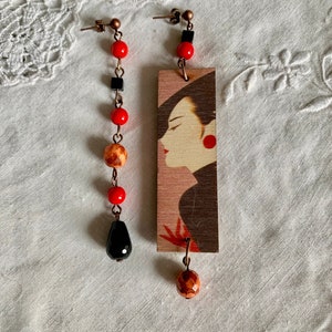 Mismatched Asymmetrical Laser Cut Cristal and Glass Drop Earrings.