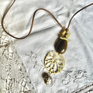 Brown Suede Cord Necklace With Ceramic Oval, Sphere, Flower and Pendant.