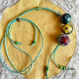 Light Green Suede Cord Necklace With Ceramic and Wood Spheres.