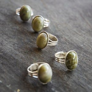 Silver adjustable ring with Irish Connemara Marble centre. Comfortably adjustable and easy to wear. Gift boxed, made and posted from Ireland