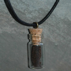 Irish Turf pendant charm with long cotton wax cord.