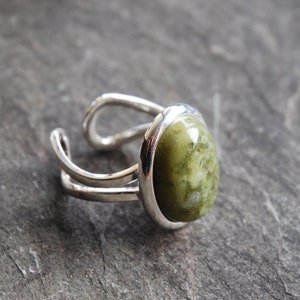 Irish Connemara Marble ring with 13 x 18mm stone. Adjustable and great quality. Made and posted from Ireland