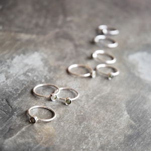 Simple Sterling silver ring with 4mm centre from Connemara marble. Available in different sizes  - Gift boxed. Made and posted from Ireland