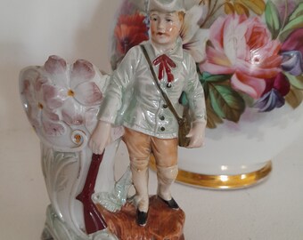 19th century enamelled porcelain figurine representing a hunter, small romantic vase, old porcelain statue collection