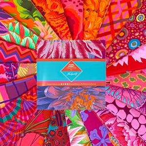 May include: A collection of colorful fabric squares arranged in a circular pattern. The fabrics feature vibrant floral and abstract designs in shades of red, pink, orange, and purple. A central package with a blue band is visible.