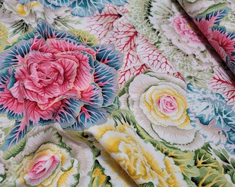 May include: A fabric featuring a repeating pattern of ornamental cabbage plants in vibrant shades of pink, yellow, teal, and green against a white background. The design showcases detailed leaf textures and layered foliage in a dense, colorful arrangement.