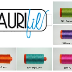 May include: Five spools of Aurifil thread in different colors: spring green, dusty lavender, orange, light jade, and fuchsia. Each spool has a white label with the Aurifil logo and the thread color name and number.