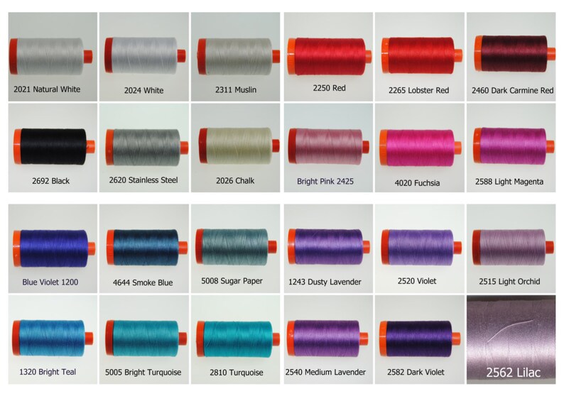 May include: A collection of 18 spools of thread in various colors, including natural white, black, red, pink, blue, teal, purple, and lavender. Each spool is labeled with a number and a color name.