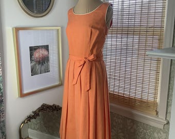Vintage peach sundress with button accents and piped edges, small-medium