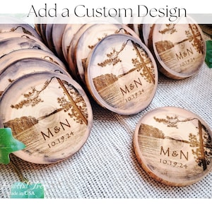 May include: A stack of round wooden coasters with a lake and pine tree design. The coasters are personalized with the initials "M&N" and the date "10.19.24".
