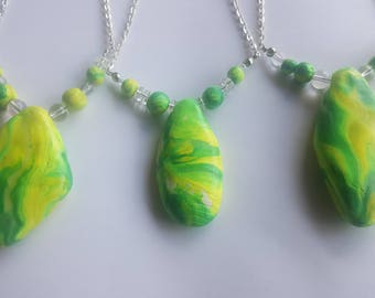 Green and yellow glow in the dark pendant