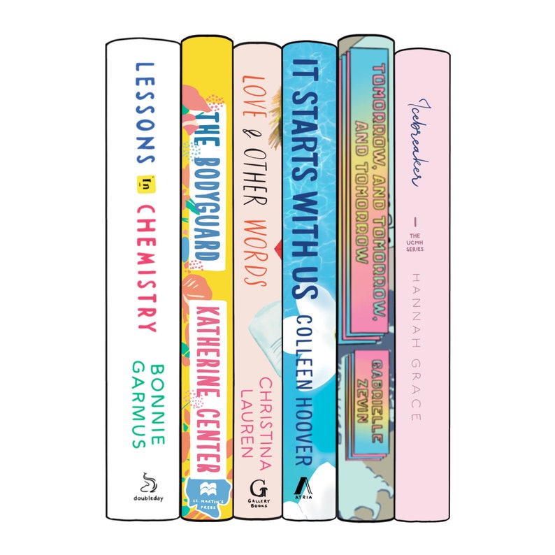 May include: A stack of seven hardcover books with colorful covers. Titles include "Lessons in Chemistry," "The Bodyguard," "Love & Other Words," "It Starts With Us," "Tomorrow, and Tomorrow," and "Icebreaker." The books are arranged vertically.